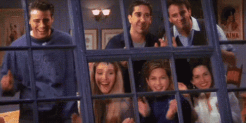 a gif of the friends clapping in the theme song